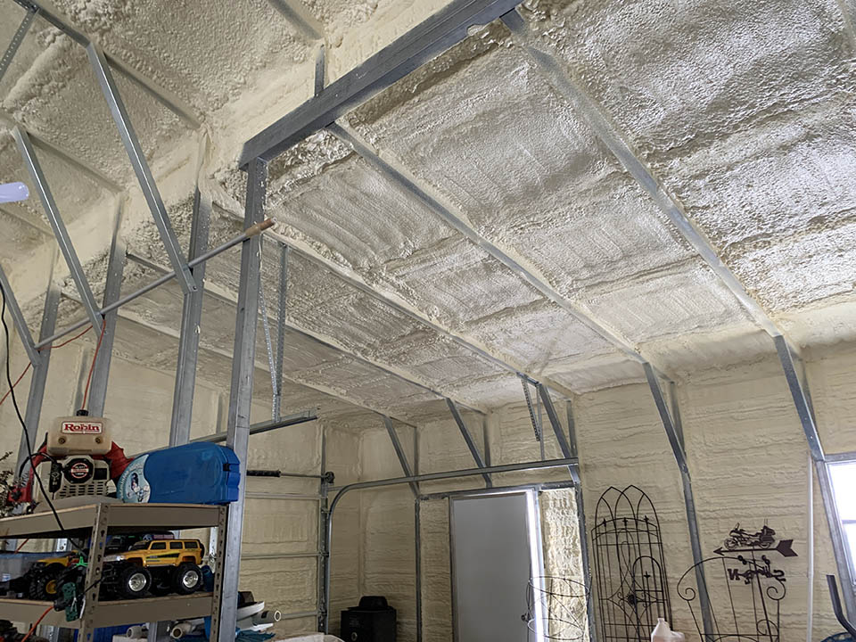 Spray foam insulation metal building